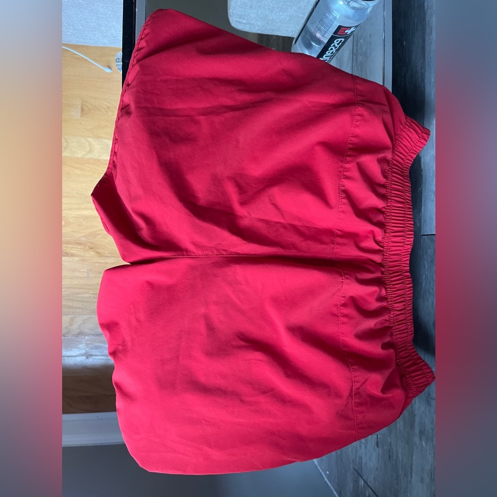 Red shorts man